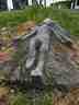 Estátua inacabada de um menino deitado
